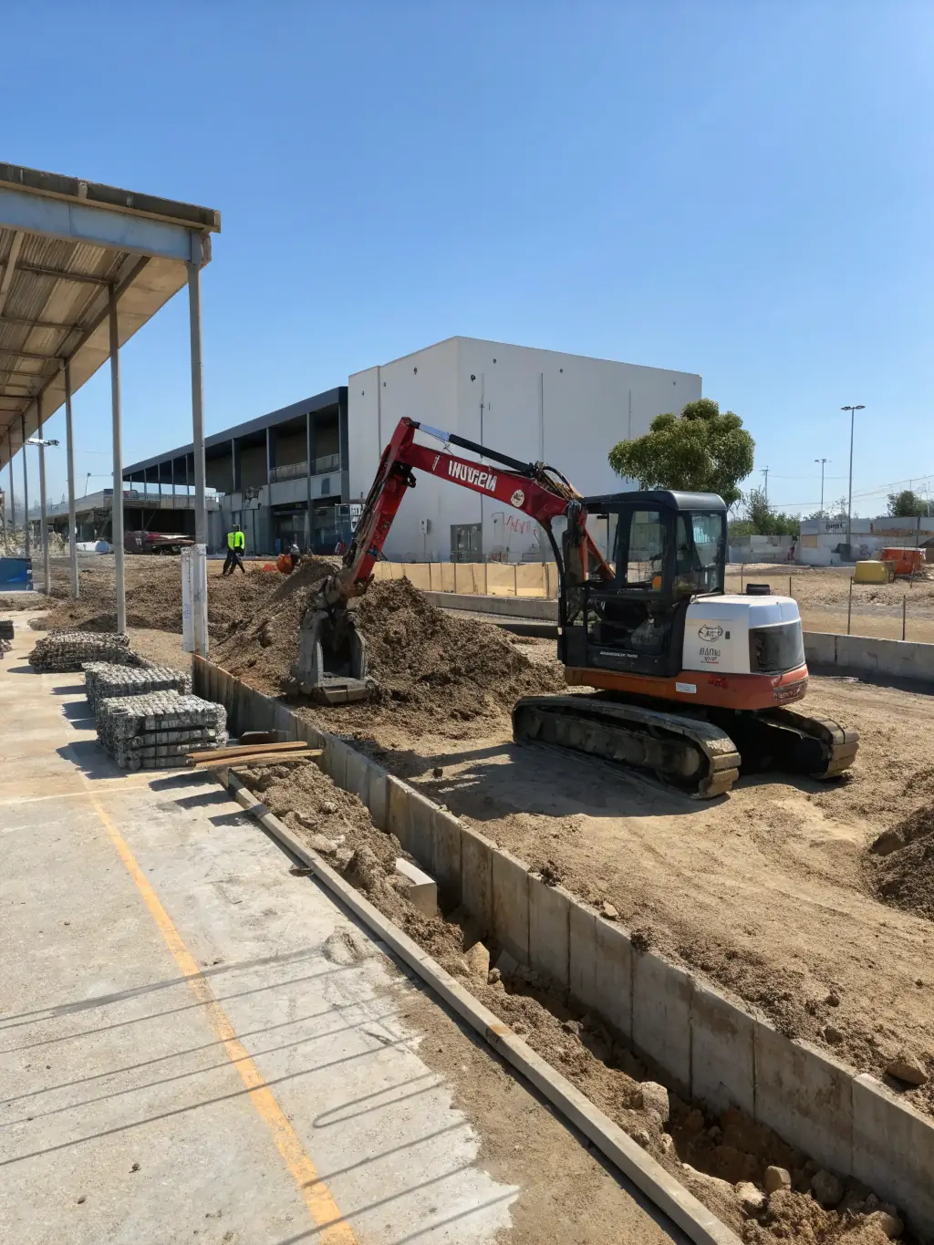 An excavator in action, moving earth at a construction site, showcasing Southside Civil and Construction's earthmoving capabilities.